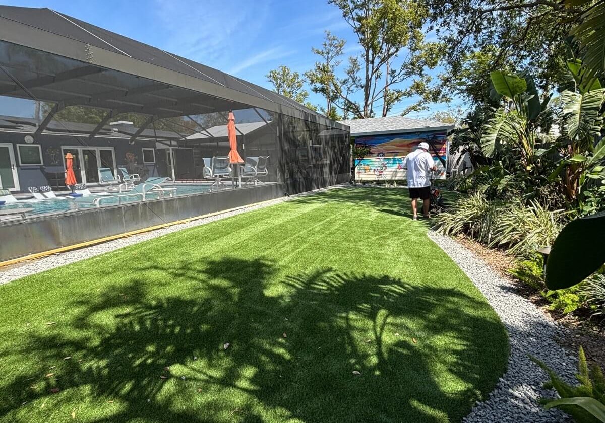 artificial turf backyard with garden beds