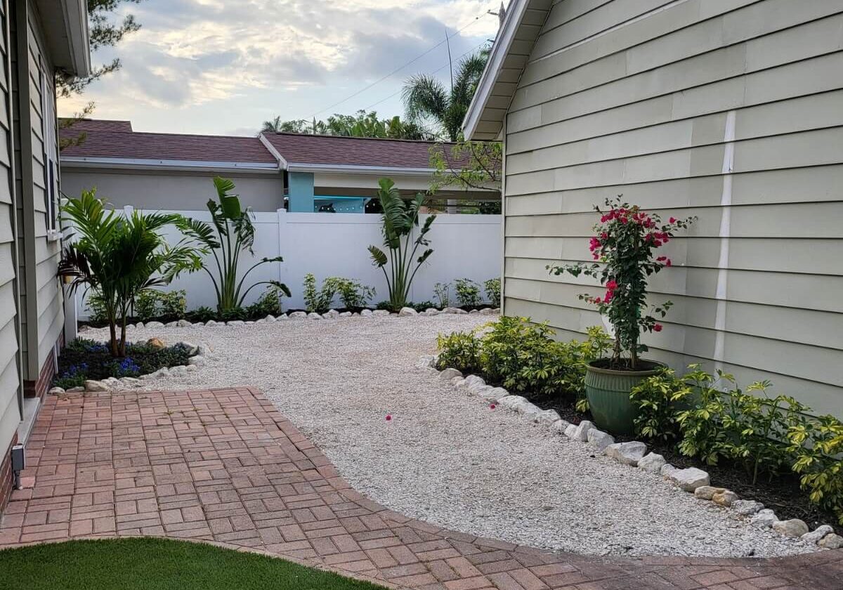 gravel backyard with garden beds