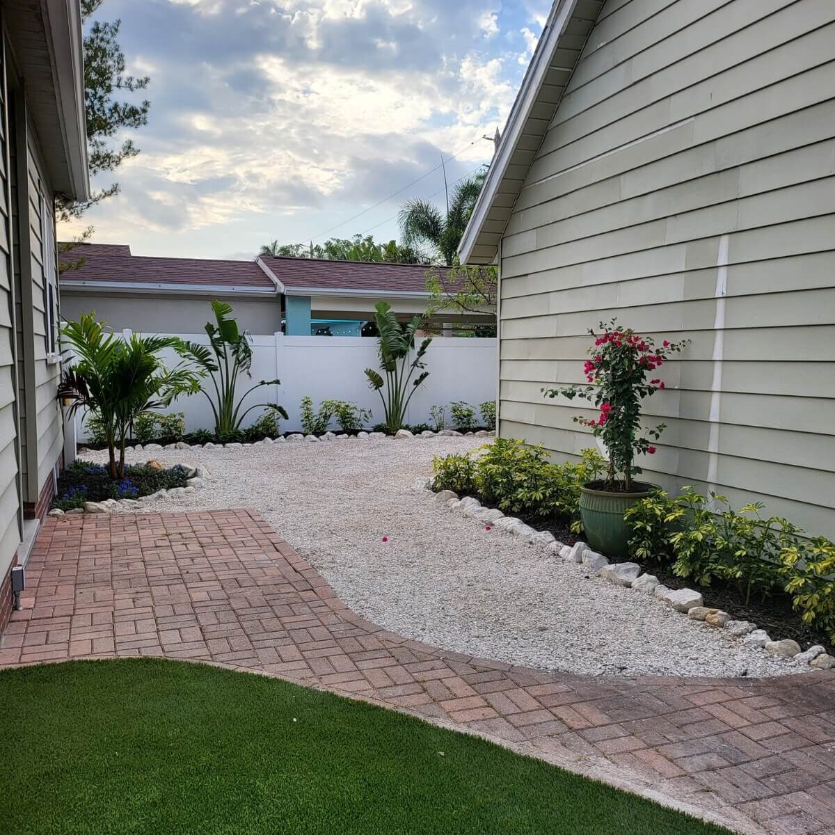 gravel backyard with garden beds